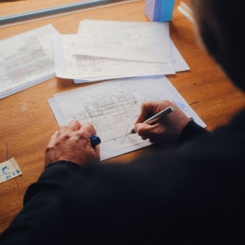 Engineer reviewing electrical drawings for DEWA approval