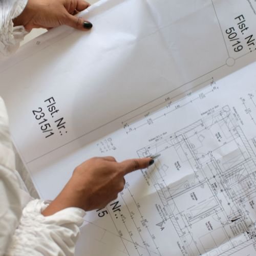 Engineers reviewing fire safety drawings for DCD approval in Dubai