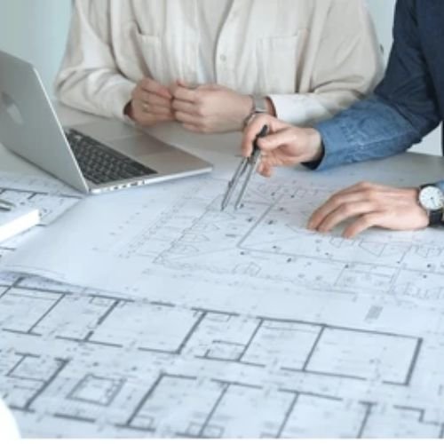 Contractor reviewing commercial fit out drawings and project cost estimate in UAE